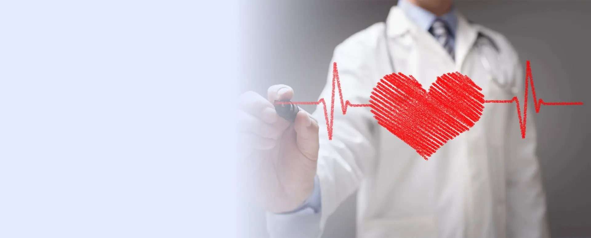 A doctor writing on the screen with a red heart