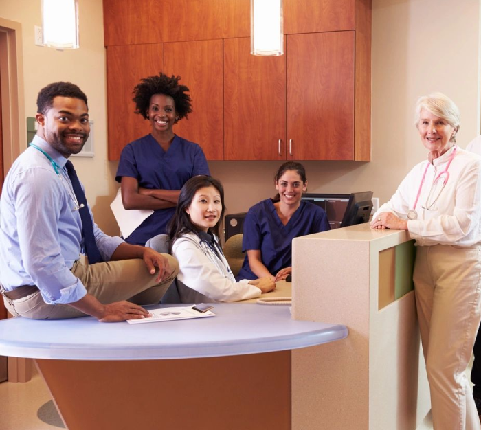 A group of people in the hospital waiting for their turn.